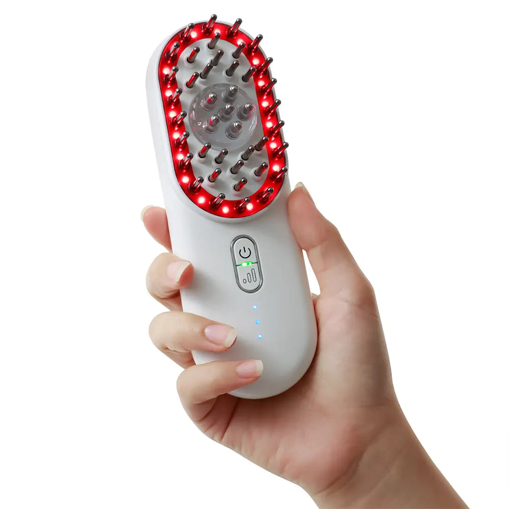Hand holding a white electronic device with red LED lights on a white background