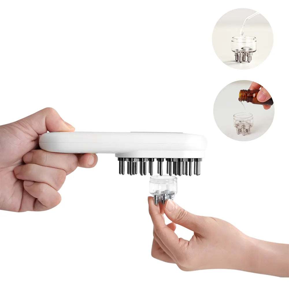 Hand holding a white hair massage comb with a clear handle on a white background