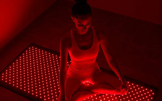 woman sitting on a therapy mat