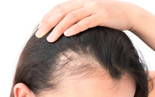 woman touch her hair 