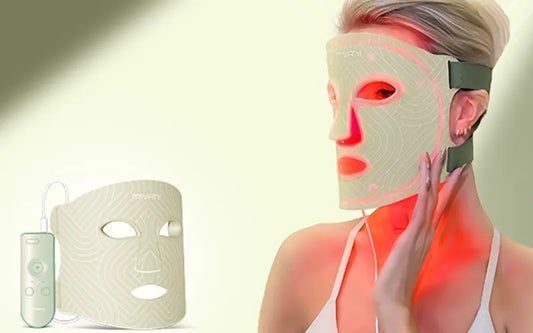 woman wearing a mivani green color light therapy face mask with green background