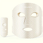 White face mask with applicator on a white background