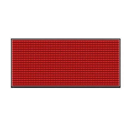 Red light therapy mat with control device and person using it on a white background