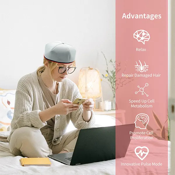 Woman using a device on her bed with a pink panel detailing advantages of the red light therapy hat.